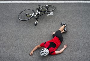 45092668 - unconscious cyclist in the road